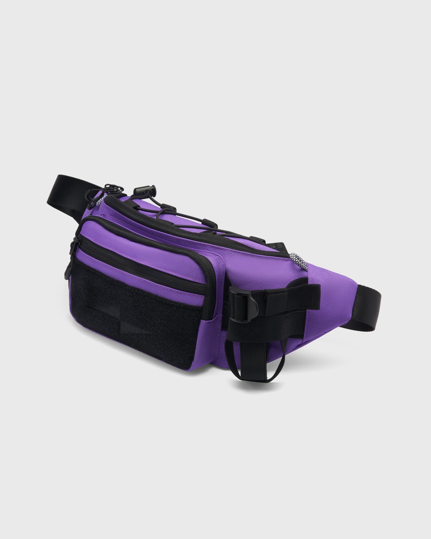 Sacoche OMNI PACK BELT BAG AVNIER violet, vue de profil, format 1,5L avec porte-gourde ajustable et attaches techniques latérales. - violet